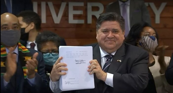 Pritzker with bill